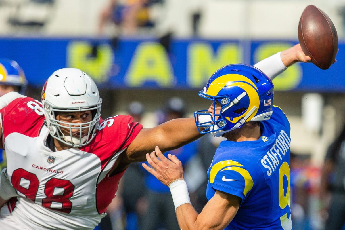Arizona Cardinals defensive tackle Corey Peters pressures Rams quarterback Matthew Stafford