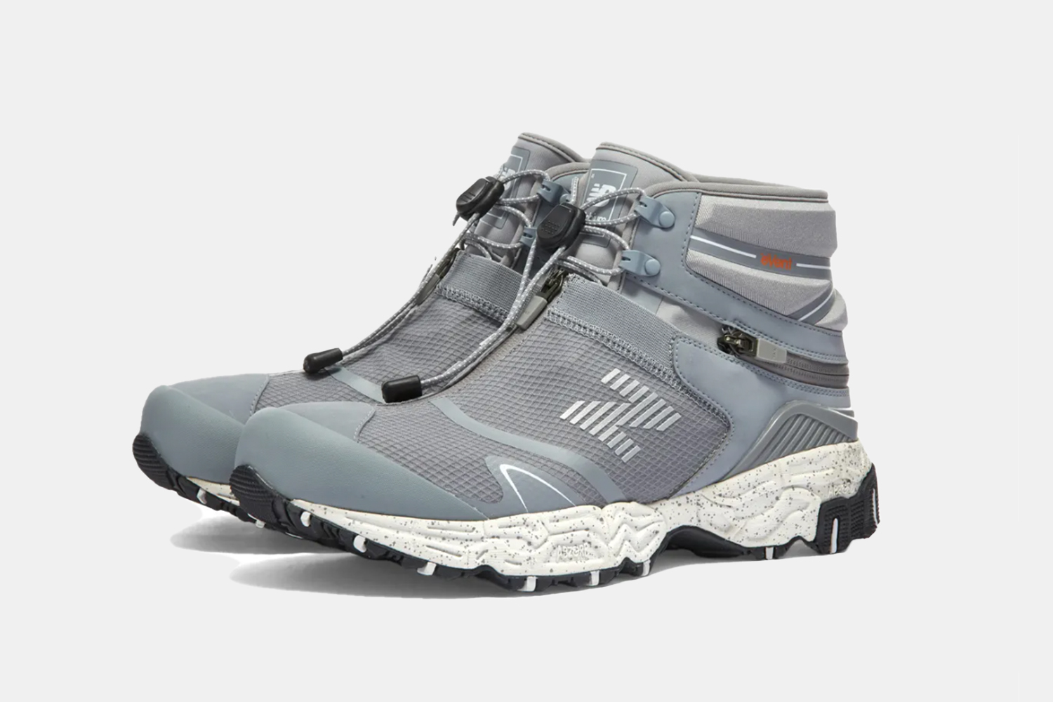 a pair of new balance sneaker boots