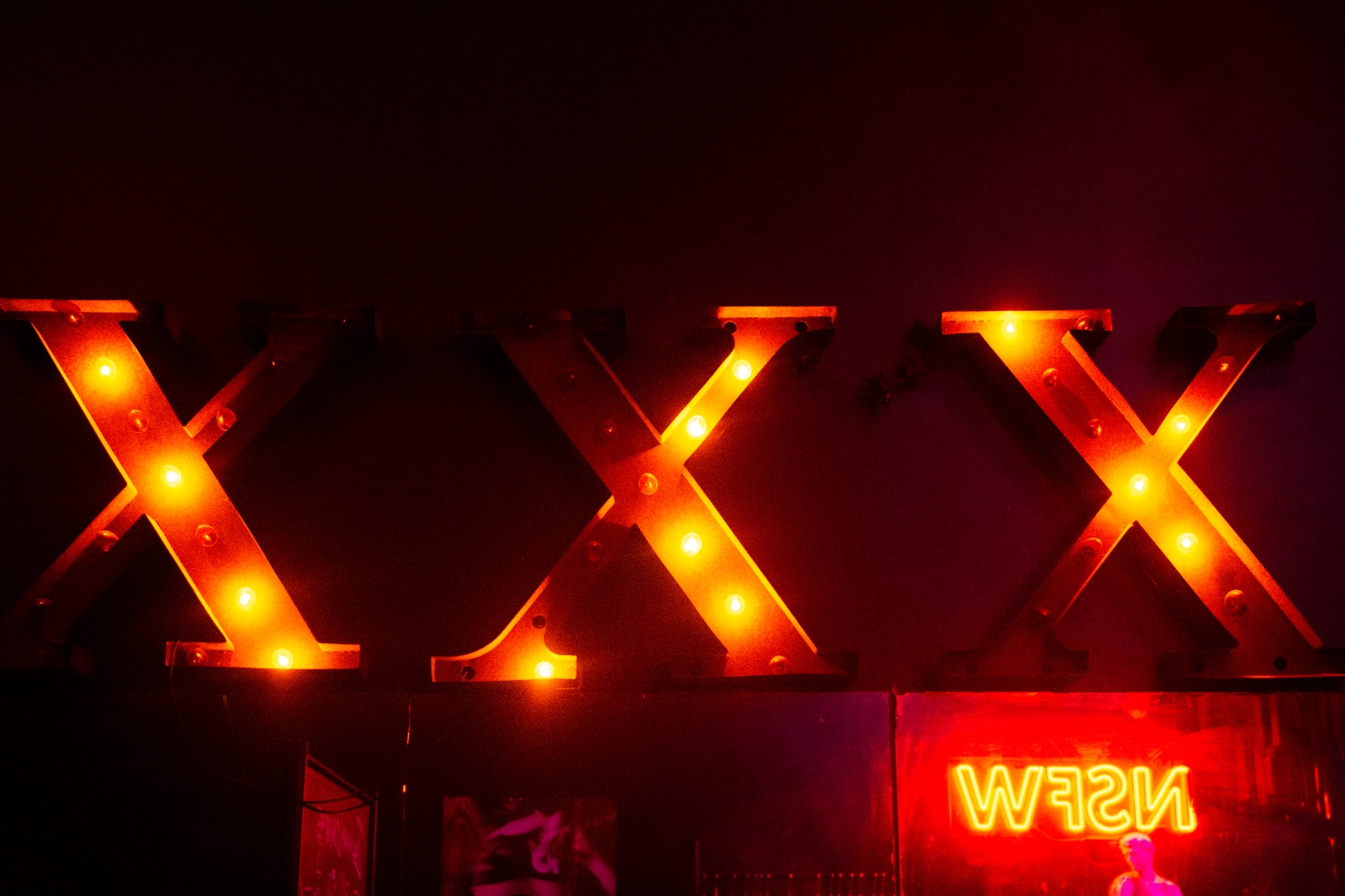A sign spells "XXX" in lightbulbs