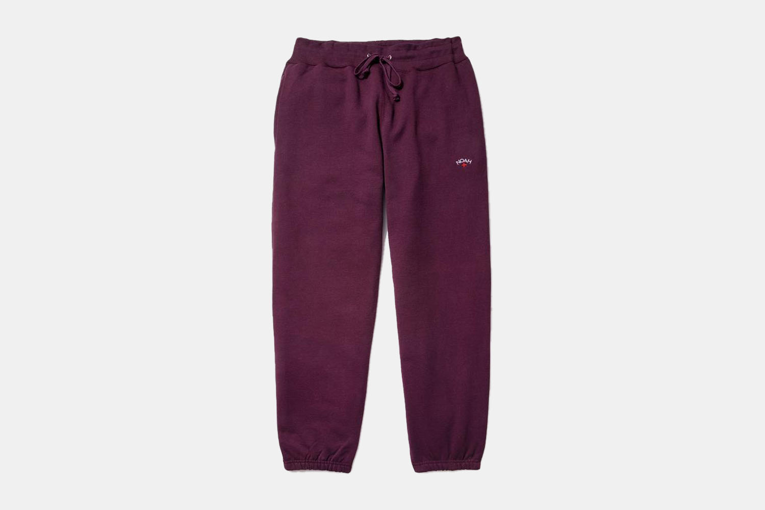 a pair of plum colored sweatpants 