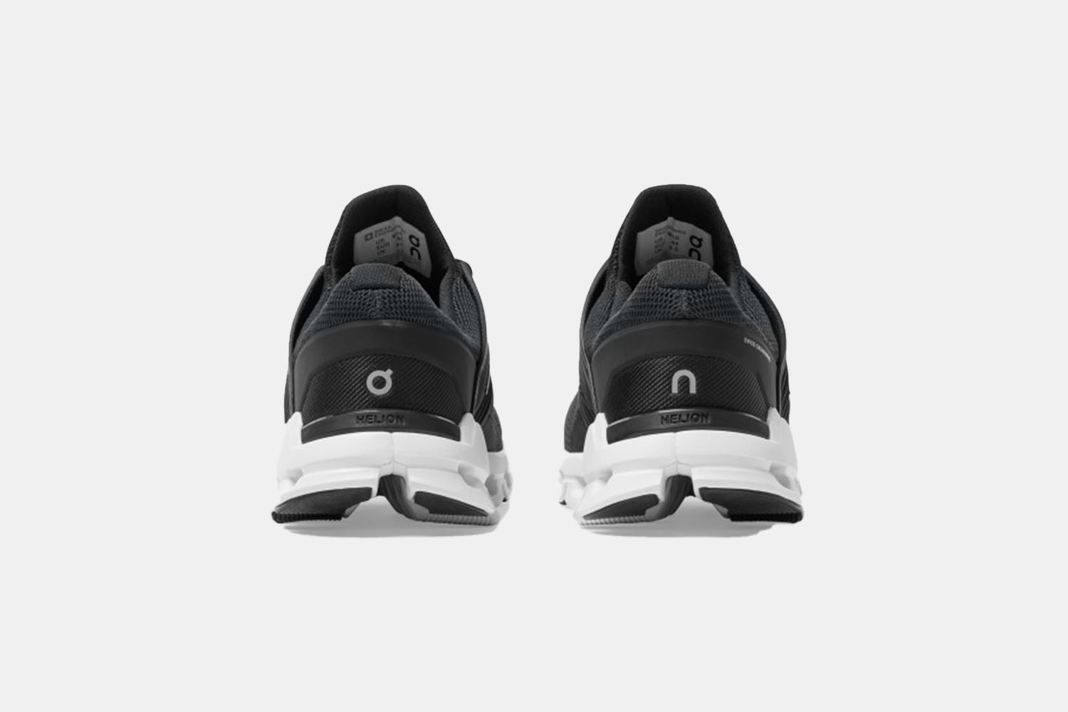 a pair of black trainers from behind