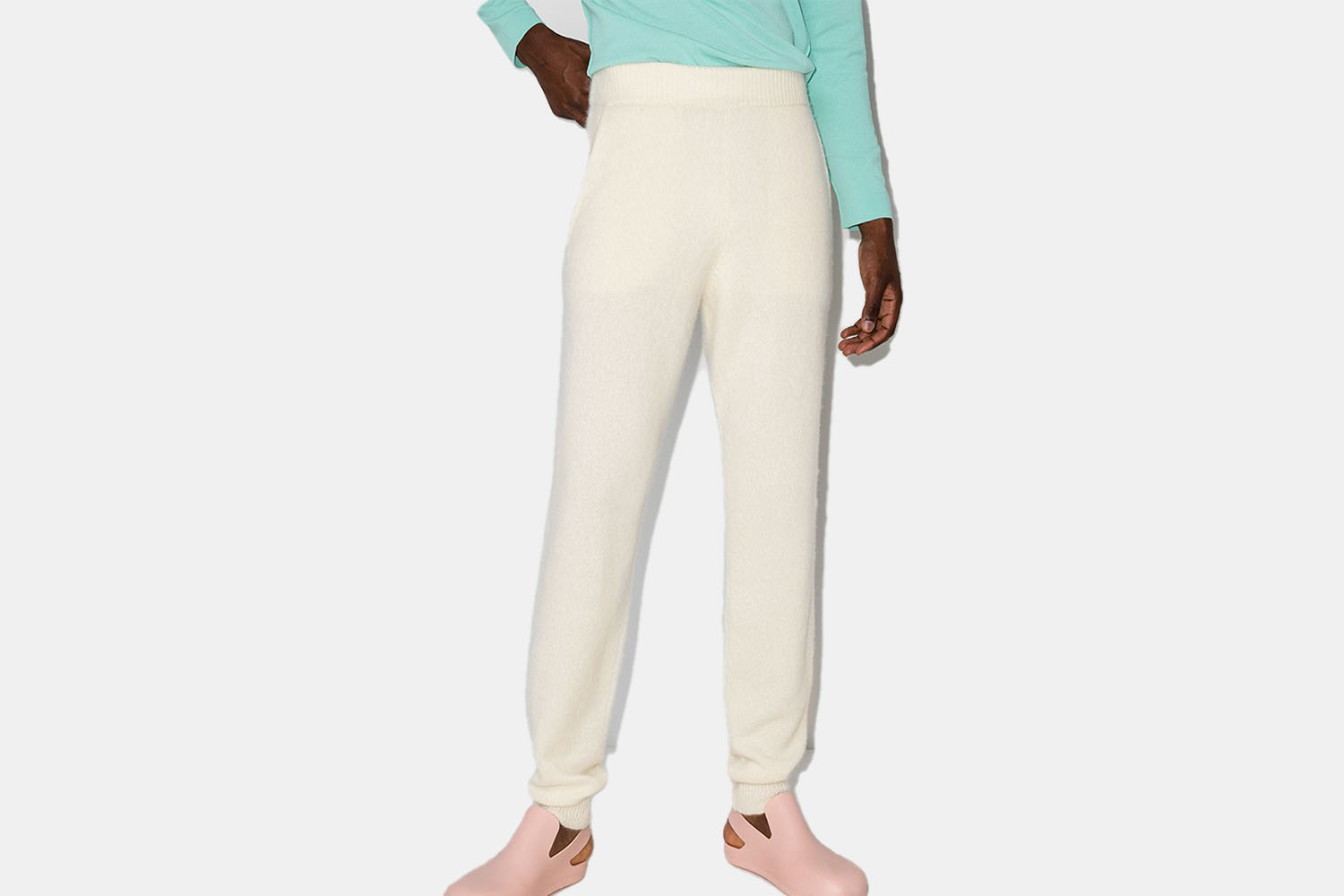 a model in some white-cream sweatpants 