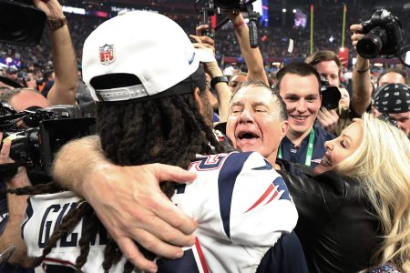 Patriots head coach Bill Belichick and Linda Holliday celebrate with Stephon Gilmore
