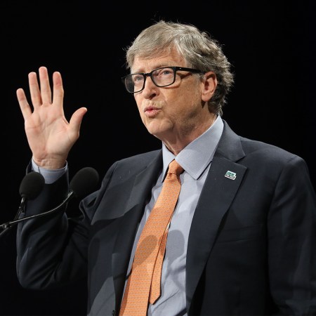 Bill Gates with a suit and tie at a lectern speaking in October 2019 in Lyon, France