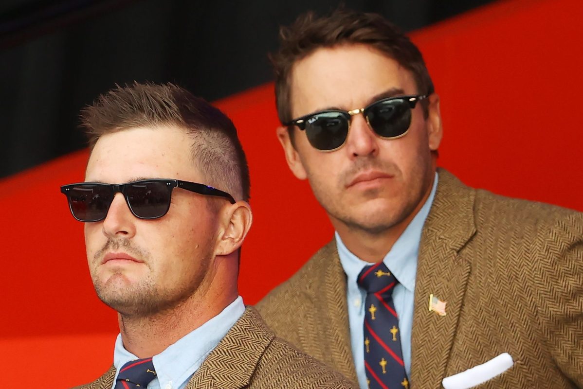 Professional golfers Bryson DeChambeau and Brooks Koepka, both wearing sunglasses, at the opening ceremony for the 43rd Ryder Cup