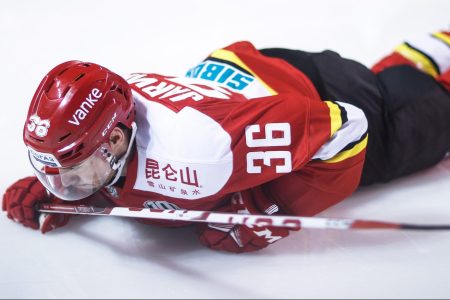 Joonas Jarvinen of HC Kunlun Red Star falls down
