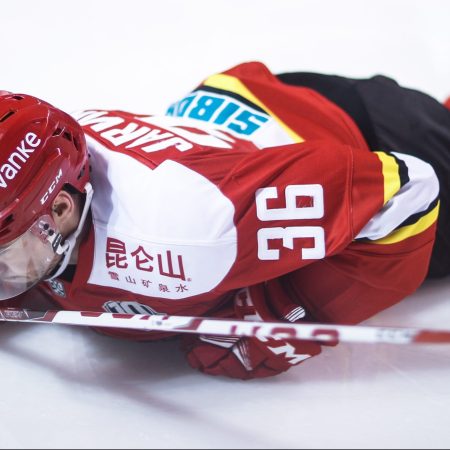 Joonas Jarvinen of HC Kunlun Red Star falls down
