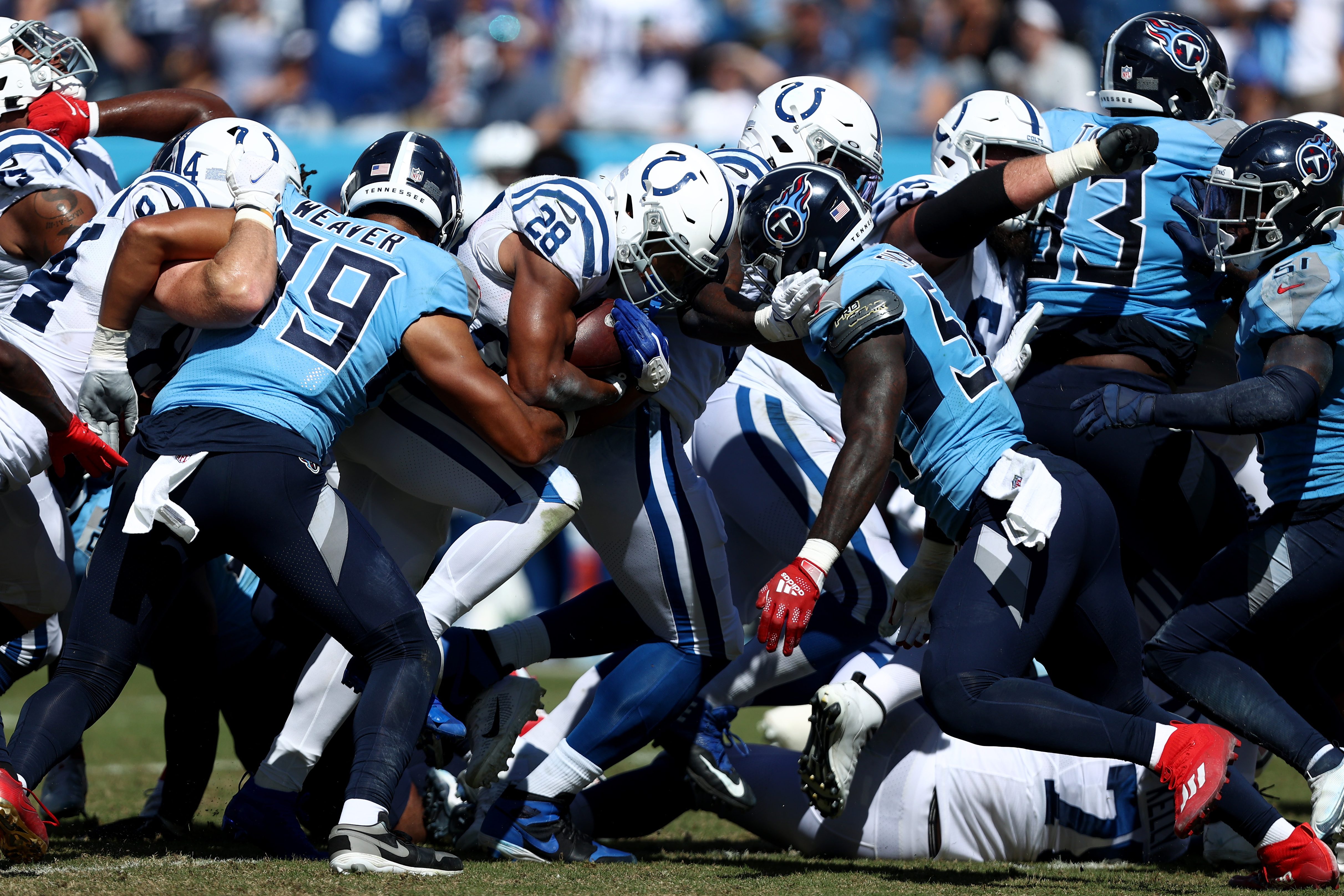 Jonathan Taylor of the Indianapolis Colts runs the ball against the Tennessee Titans