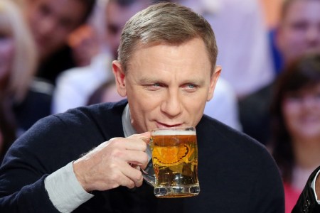 James Bond actor Daniel Craig sipping a beer