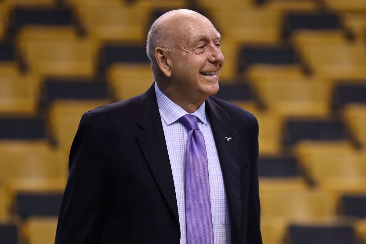 Sportscaster Dick Vitale in 2018 dressed in a suit with a purple tie before a game between the Boston Celtics and the LA Clippers at TD Garden.