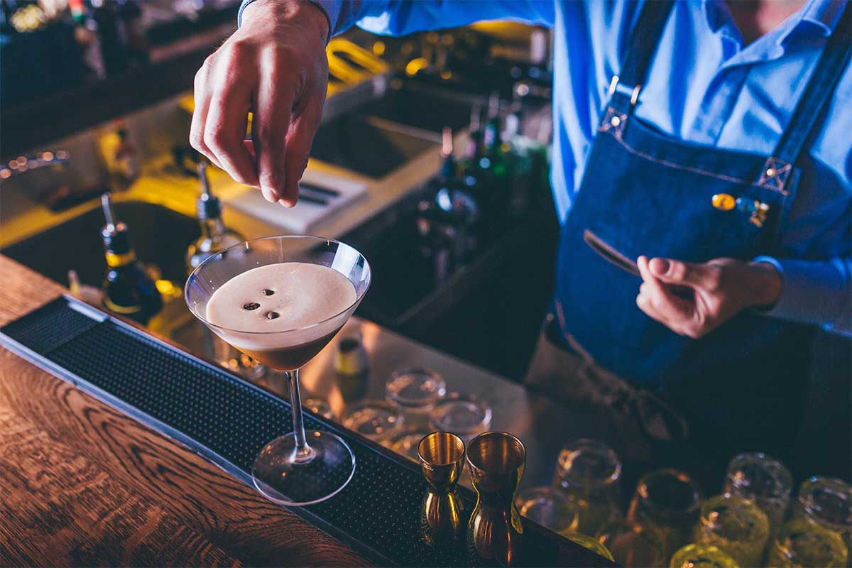 A barista/bartender prepping an espresso martini. The '90s drink staple has made a return, to the regret of some bartenders.