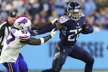 Derrick Henry of the Tennessee Titans rushes past defensive end Mario Addison. Henry had the fastest TD run of the season on Monday night