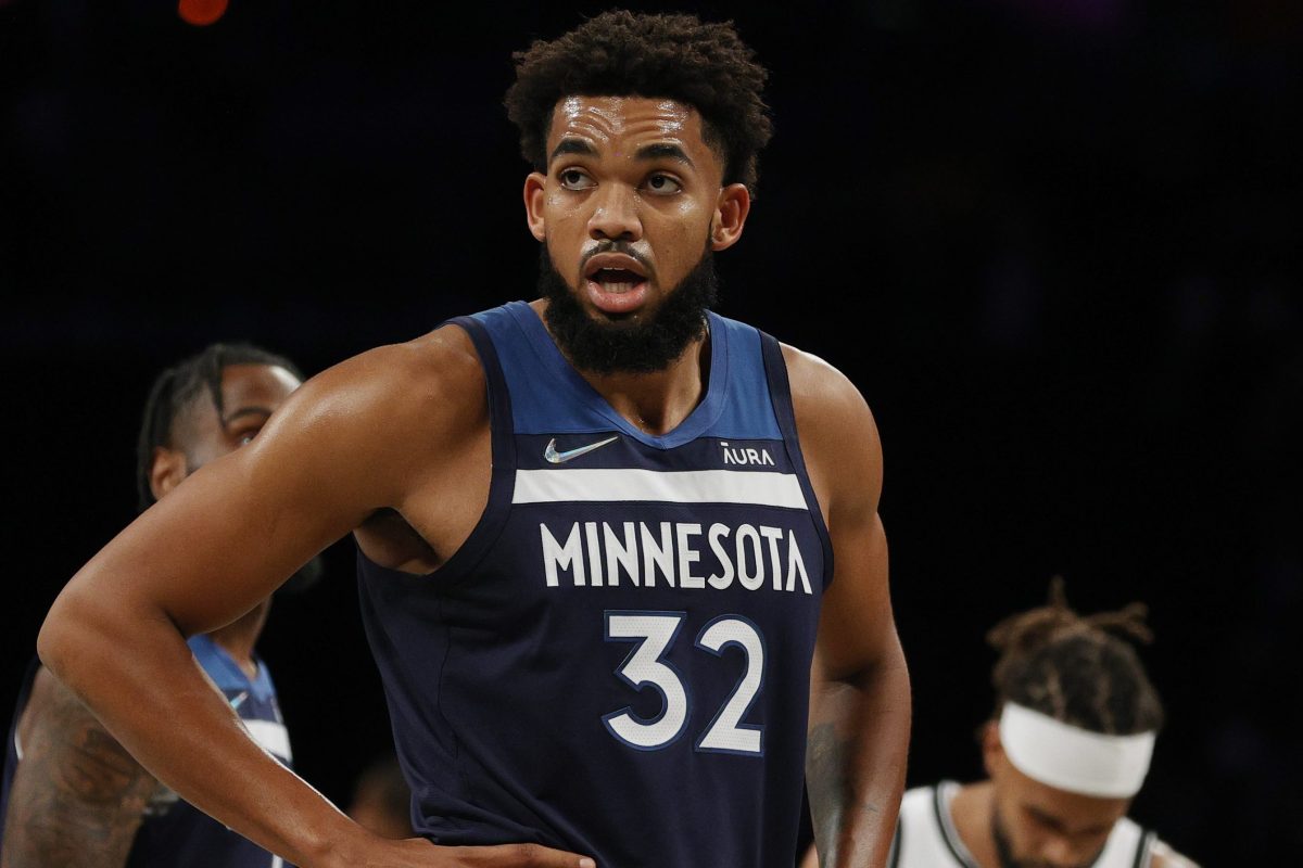Karl-Anthony Towns of the Minnesota Timberwolves on the floor. Towns watches gorilla fights before NBA games.