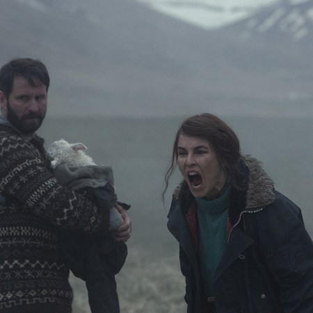 In a still from the Icelandic horror movie "Lamb," a mother screams while a father holds their hybrid lamb-human baby