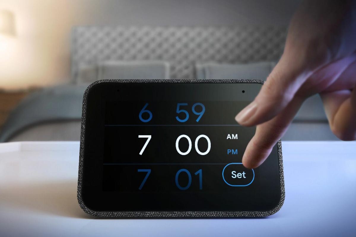 A person adjusting the time on a Lenovo Smart Clock, which is now on sale at Best Buy's eBay store