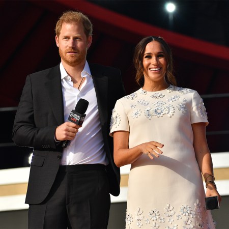 Prince Harry and Meghan Markle, the Duke and Duchess of Sussex, holding microphones onstage at Global Citizen Live on September 25, 2021 in New York City