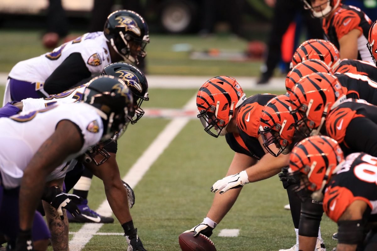 Baltimore Ravens and Cincinnati Bengals players line up for a play