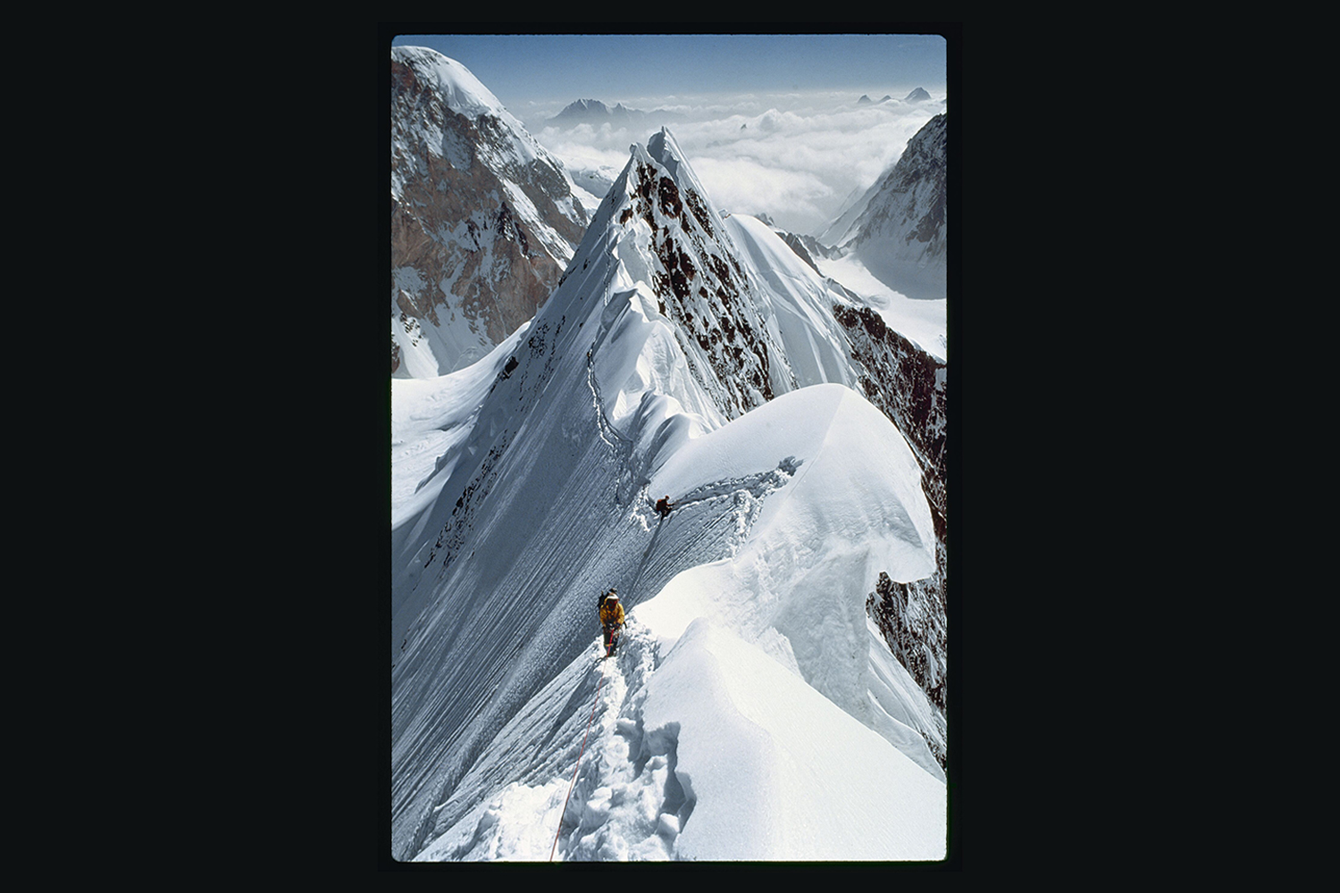 Rick Ridgeway on the northeast ridge, or knife-edge, of the mountain K2, with Lou Reichardt in the background