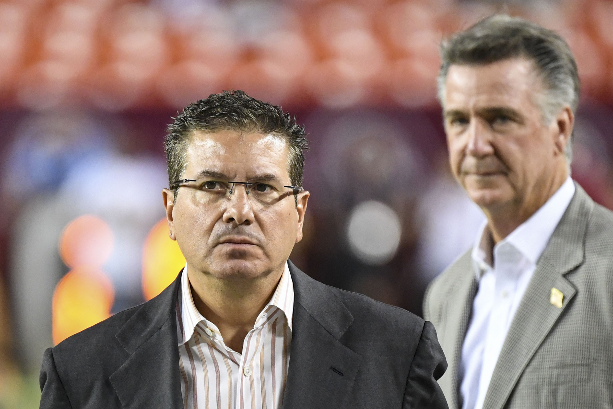 WFT owner Dan Snyder paces the sidelines in front of former general manager Bruce Allen at a game against the Chicago Bears in 2019