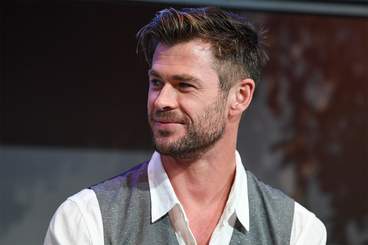 Chris Hemsworth smiling at a press event