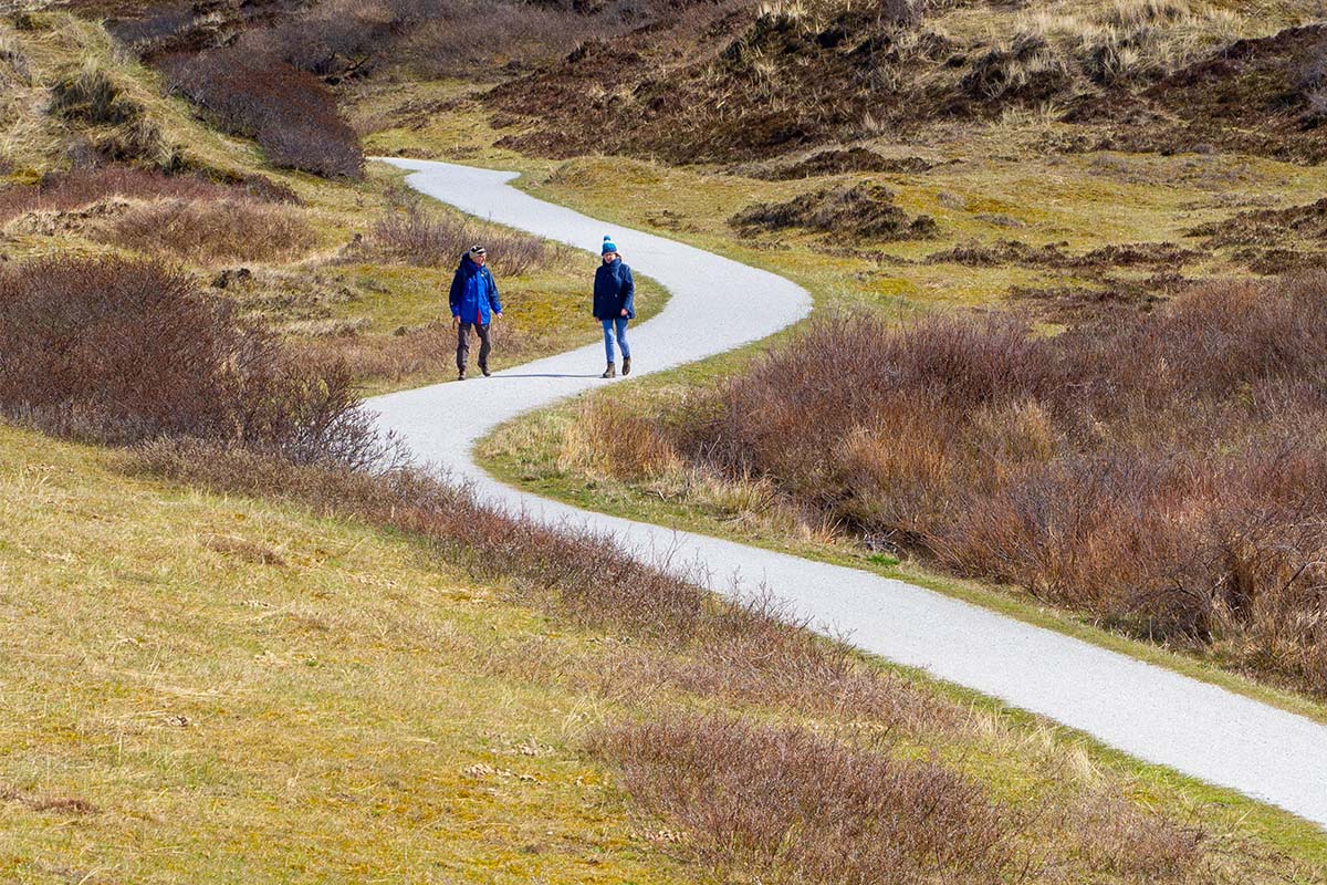 A couple walking outside. Walking several miles was a popular choice in a recent Reddit discussion on getting healthier.