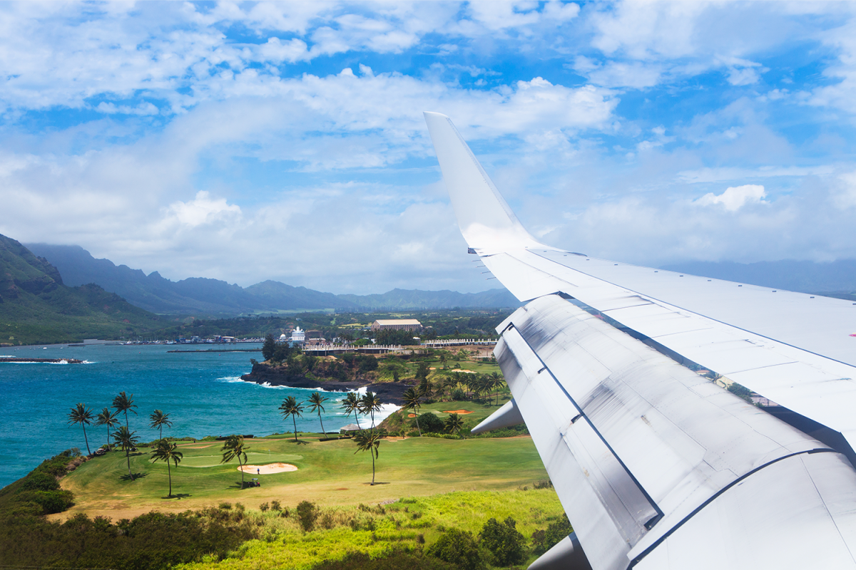 A plane flies into Lihue airport on Kauai