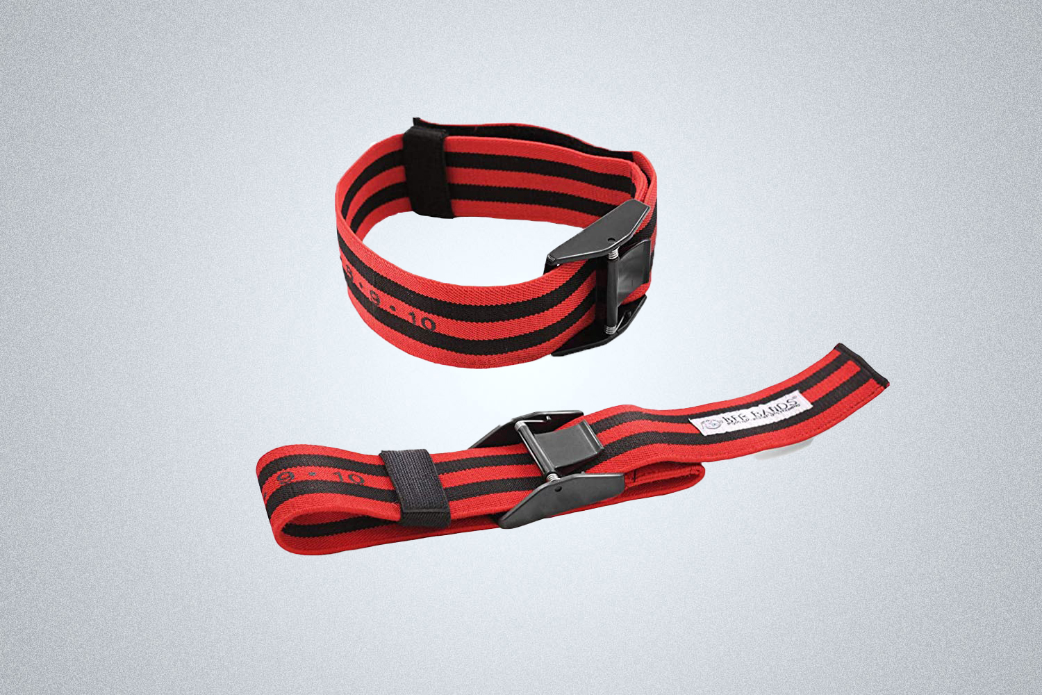 The BFR Pro X Blood Flow Restriction Bands in red and black is a portable piece of fitness equipment designed to build bigger muscles when working out