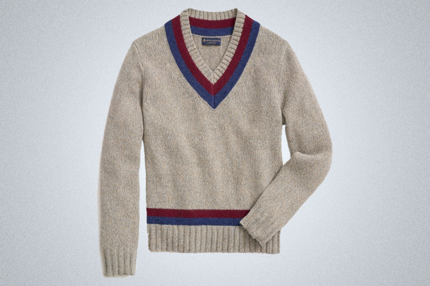a greyish cream tennis sweater