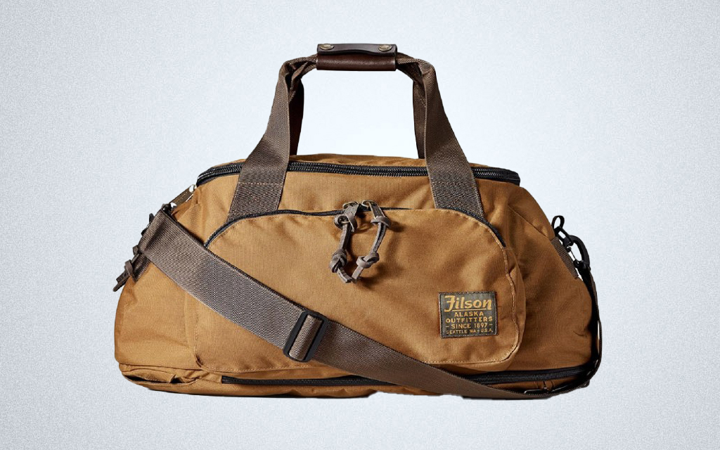 The Filson Ballistic Nylon Duffel Backpack Hybrid transforms from a duffel to a backpack for the outdoors