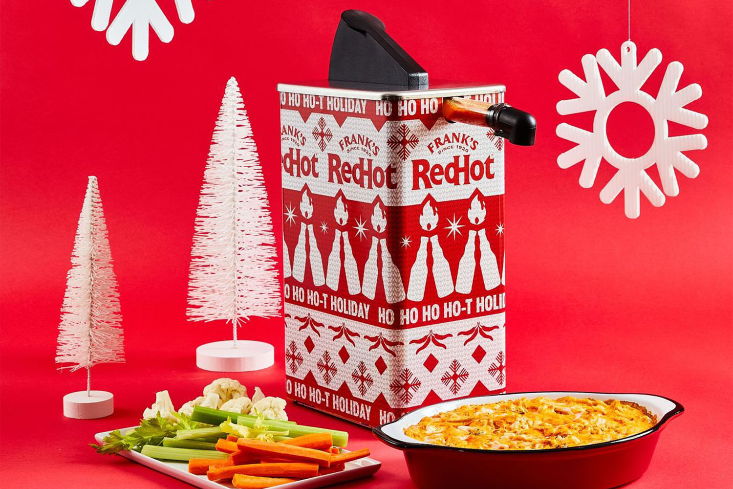 a dupable hot sauce dispenser on a Christmas themed background