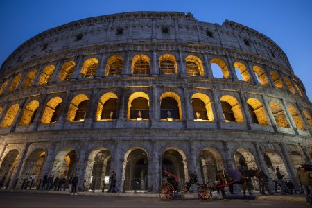 The Colosseum at night in Rome, Italy, where two American tourists were caught drinking beer and heavily fined