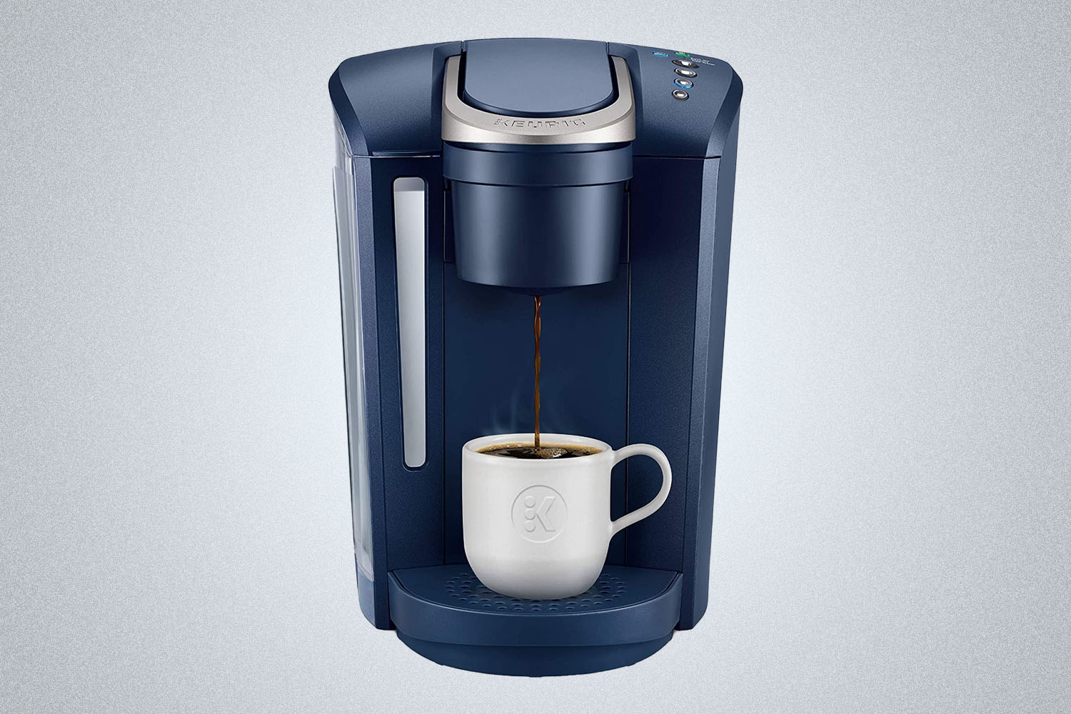 a coffee maker during into a cup