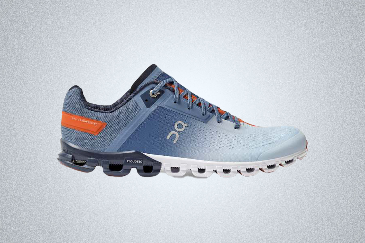 The On Running Cloudflow Shoe training shoe in blue and orange is one of the best fitness shoes in 2021 for trainers, runners and CrossFit athletes alike