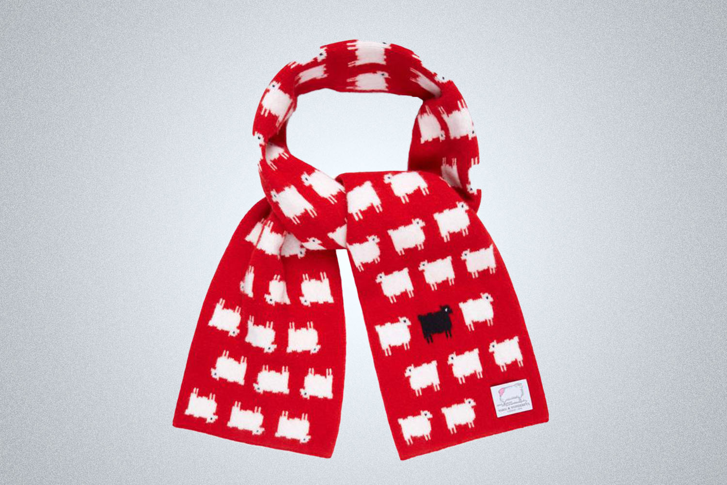 a scarf with an embodies sheep pattern