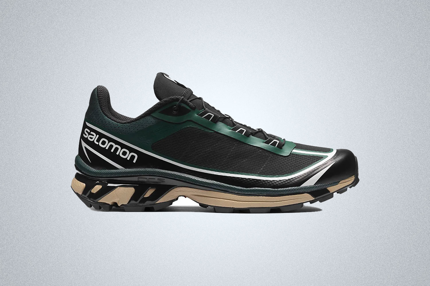 a pair of green and black technical shoes 