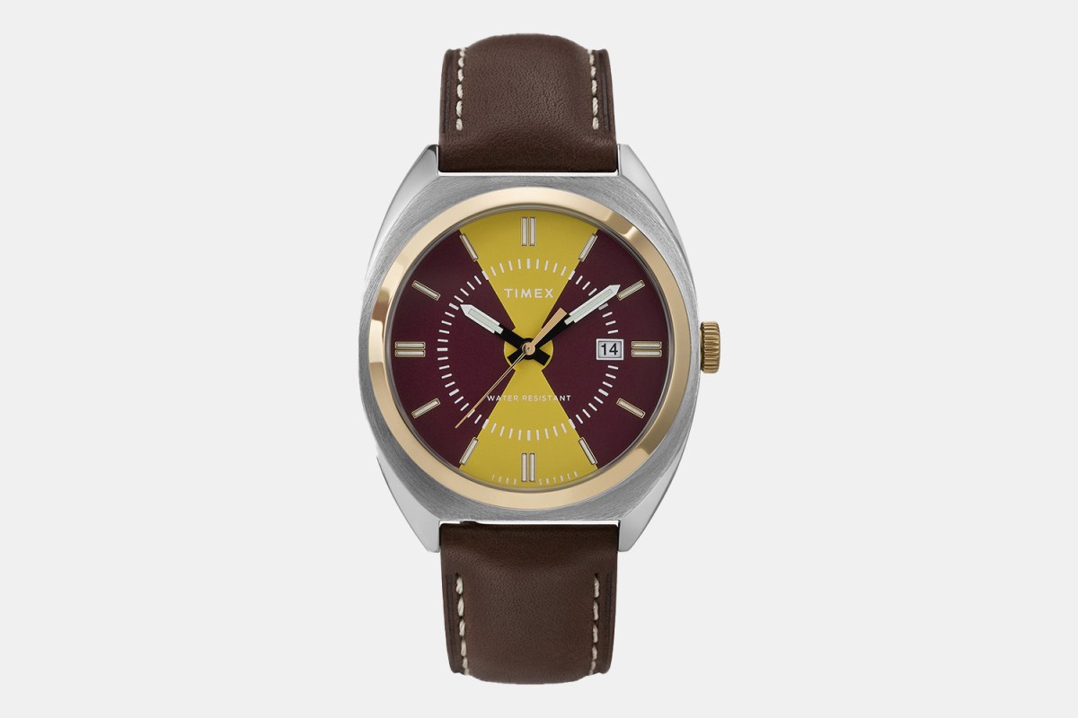 a two-toned watch with a brown leather strap
