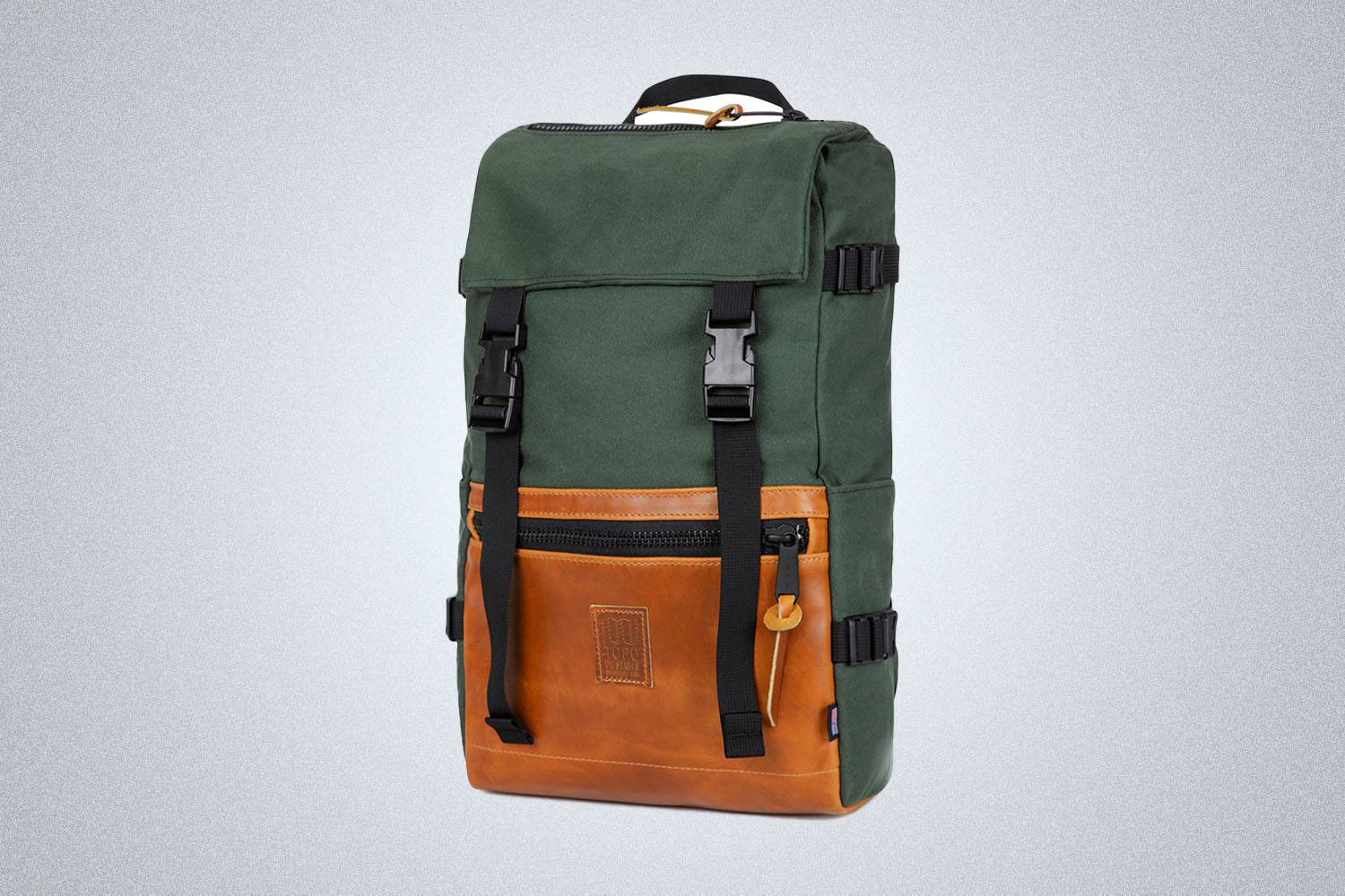 a green and tan colored backpack