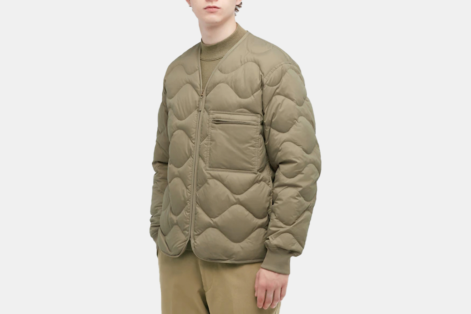 A model in a quilted puffer jacket