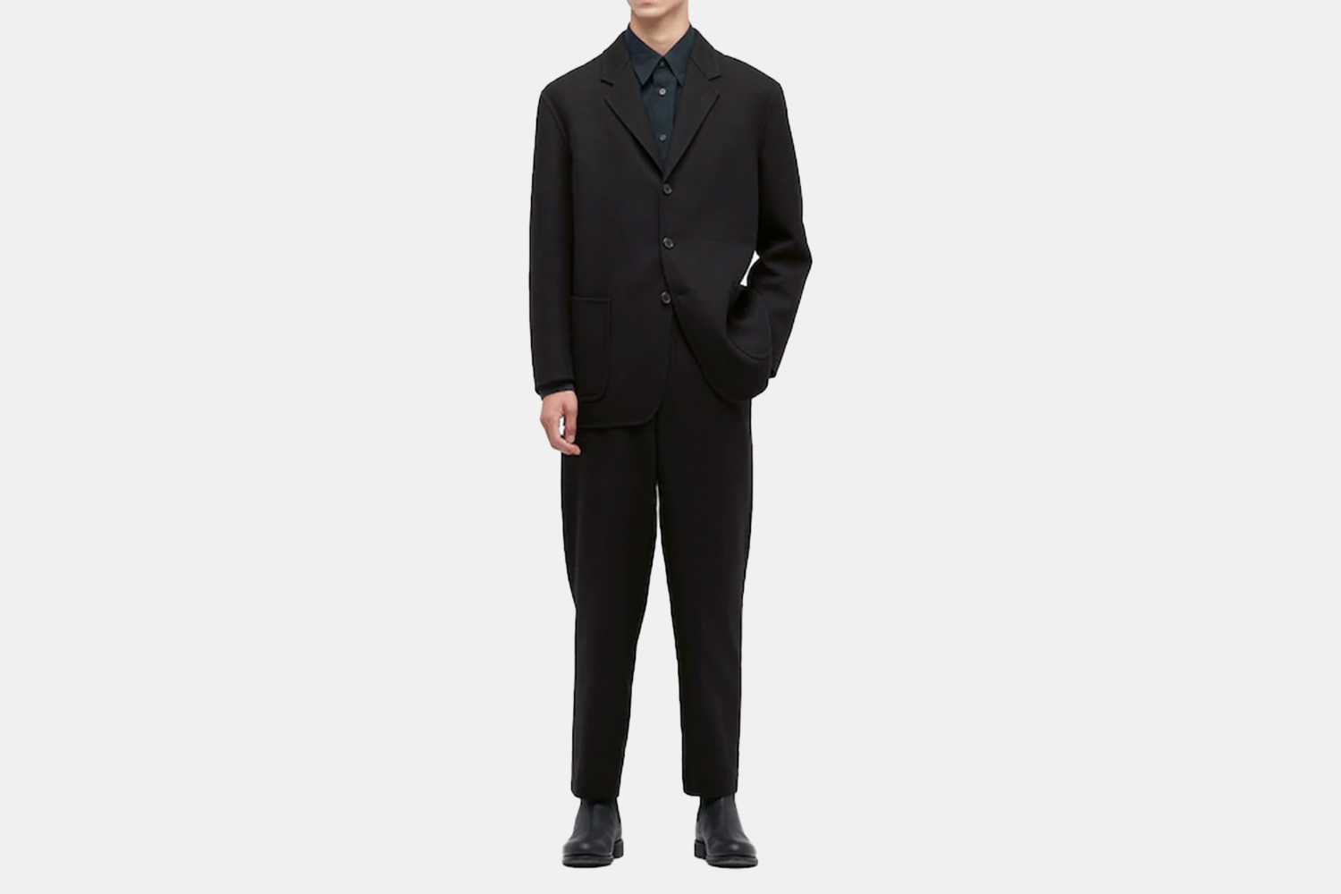 a model in a black suit