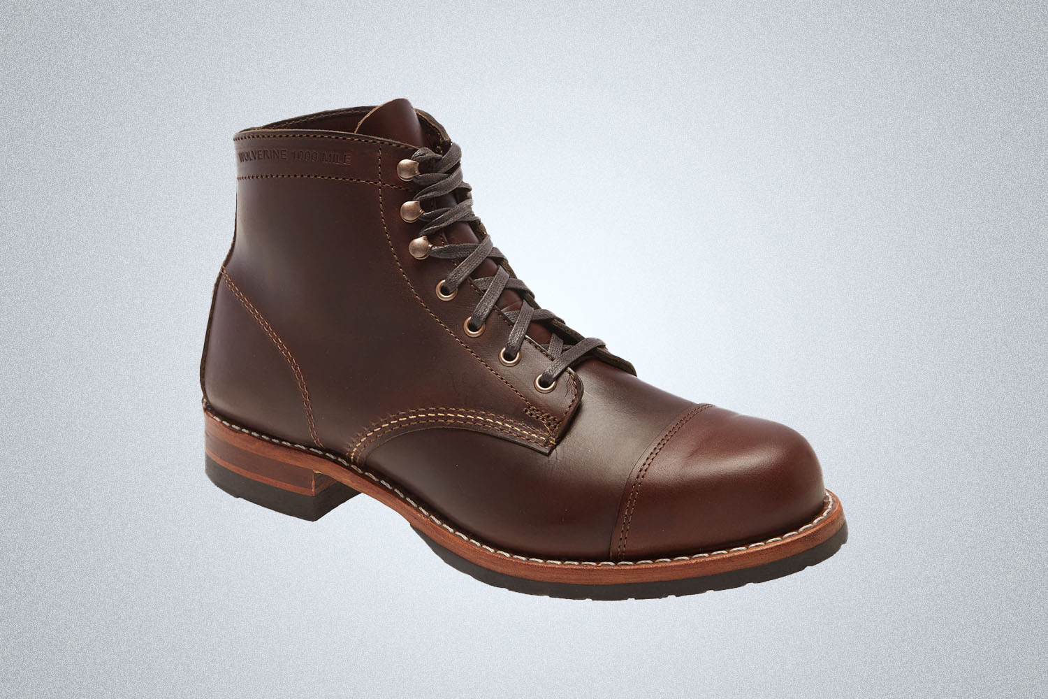 a brown cap toed boot 