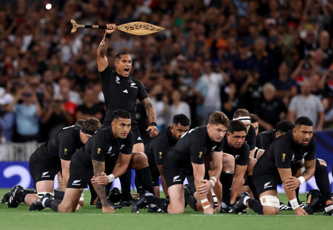 The All Blacks rugby side performing the traditional haka dance.