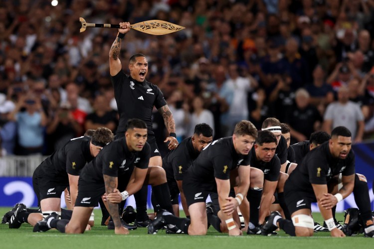 The All Blacks rugby side performing the traditional haka dance.