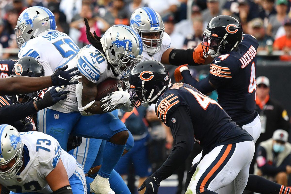 Jamaal Williams of the Detroit Lions runs with the ball against the Chicago Bears at Soldier Field