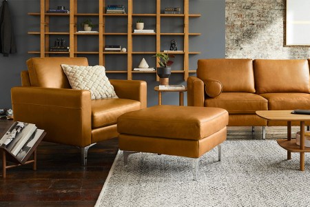 A leather armchair, ottoman and couch from Burrow, all of which are on sale during the furniture brand's early Black Friday sale in November 2021