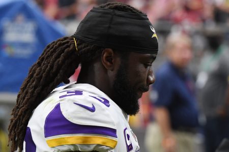 Dalvin Cook of the Vikings walks to the locker room at halftime. The running back has been accused of assault (he has claimed he was assaulted and defending himself)
