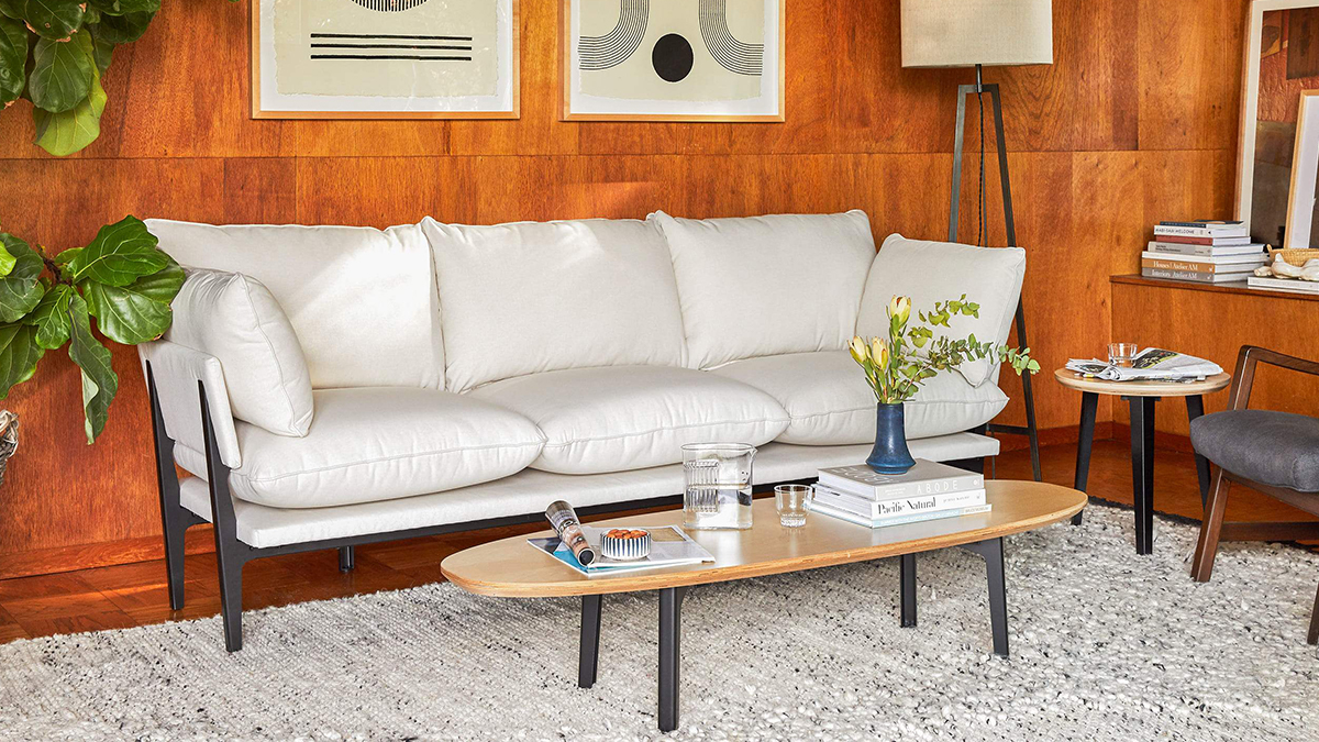 The Sofa from direct to consumer furniture brand Floyd in a living room with their Coffee Table