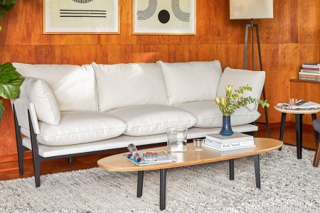 The Sofa from direct to consumer furniture brand Floyd in a living room with their Coffee Table