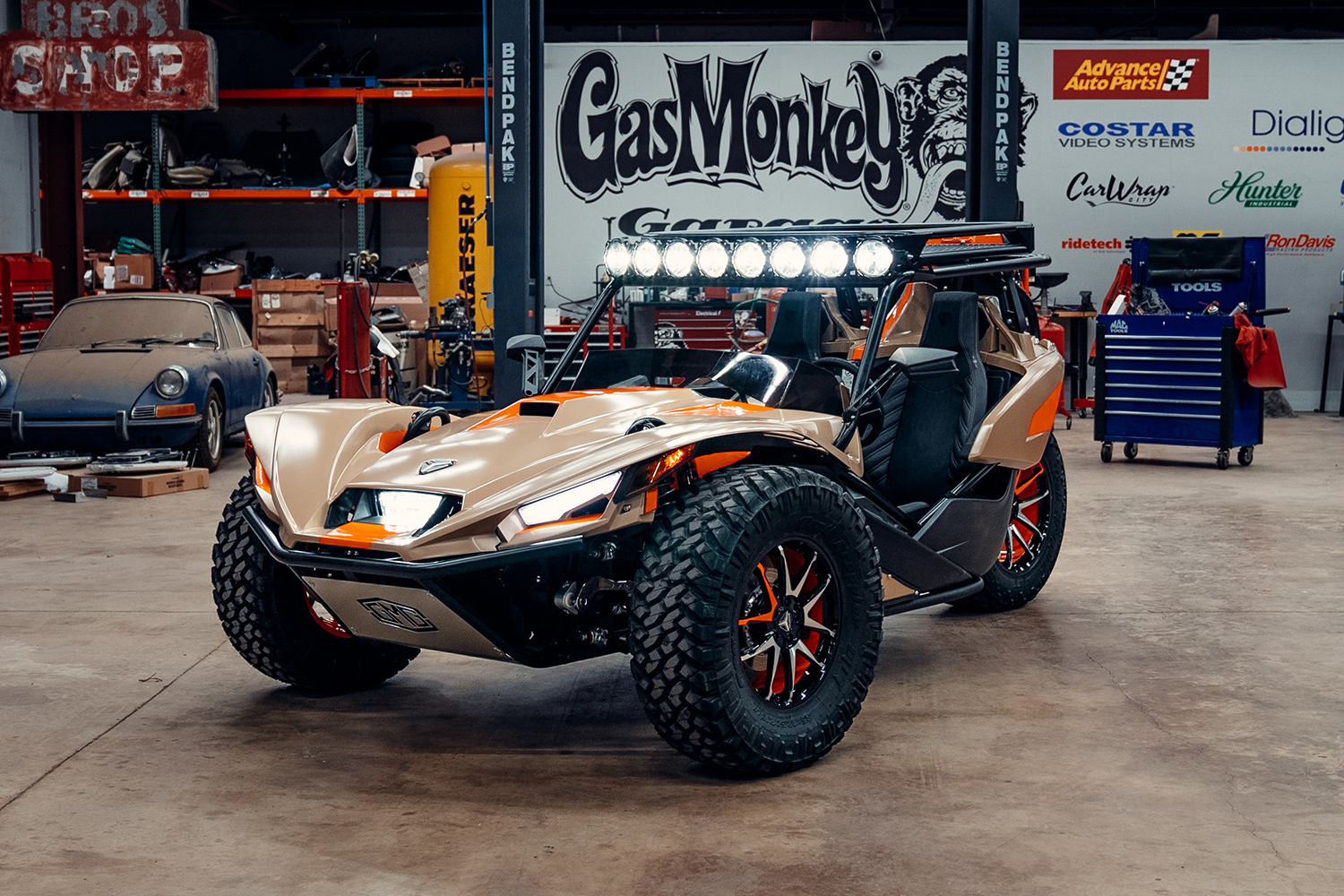 The Urban Assault Polaris Slingshot in the Gas Monkey Garage built by Richard Rawlings's team for SEMA 2021. The three-wheeler features a number of custom elements.