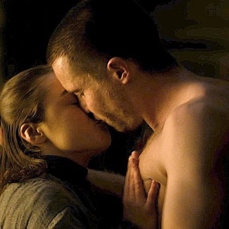 Maisie Williams as Arya Stark and Joe Dempsie as Gendry kiss in a scene from "Game of Thrones"