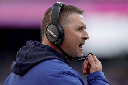 Giants head coach Joe Judge wearing a Bose headset coaches against the Carolina Panthers